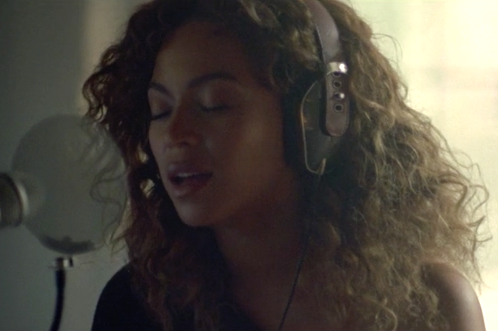 <p>"Sandcastles" is a rare, raw ballad on this album, and for this hair look Beyoncé is all soft curls and headphones. Here her hair is darker than in other scenes, deepening into brown that looks truly natural, healthy and lustrous.</p>