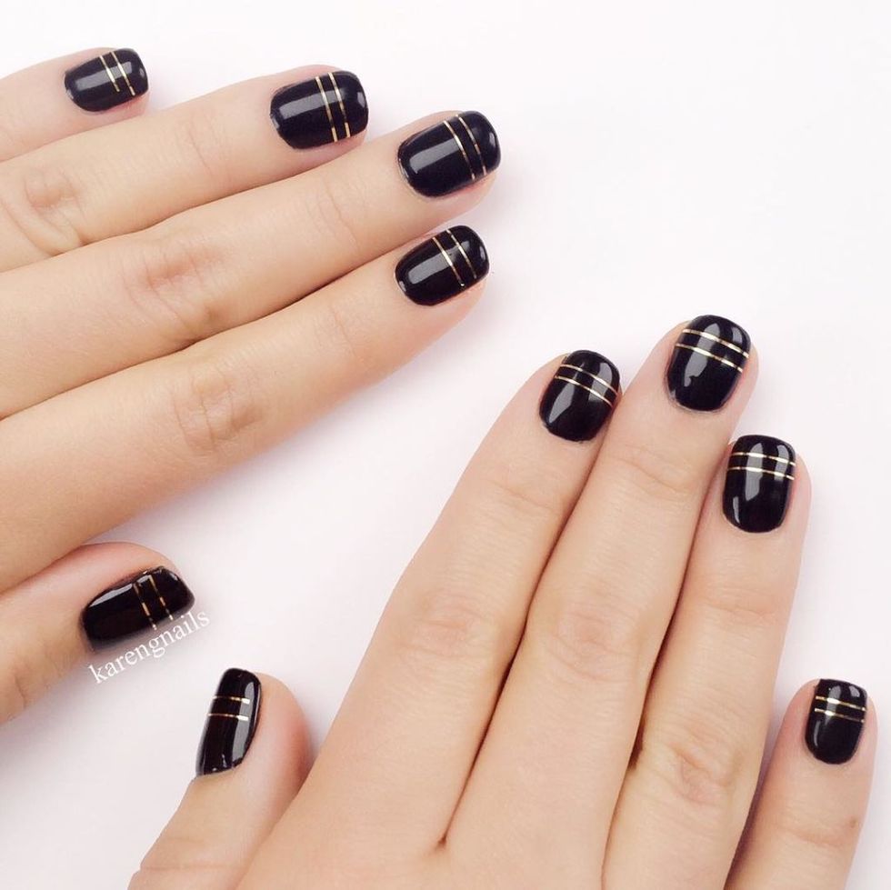 <p>For a luxe nail, try this high-shine look from celebrity manicurist Karen Gutierrez. Start with a black base, then add parallel lines of gold nail tape just below your tips. Seal it with a clear top coat. </p><p>Design by <a href="https://www.instagram.com/p/94tH4AQ3-v/" target="_blank">@karengnails</a></p>