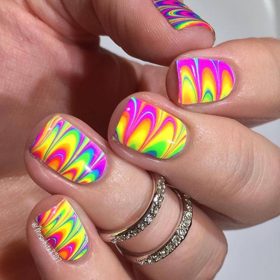 <p>If you're a fan of marbled nails, try this neon version for summer. Start with a white base to make the colors pop, then check out this <a href="https://www.youtube.com/watch?v=0rulOos4vbY" target="_blank">detailed video</a> on how to marble your nails. And always make sure your water is room temperature, and finish it with a clear top coat. </p><p>Design by <a href="https://www.instagram.com/p/BFMa1hSJi3U/" target="_blank">@mrswhite8907</a></p>