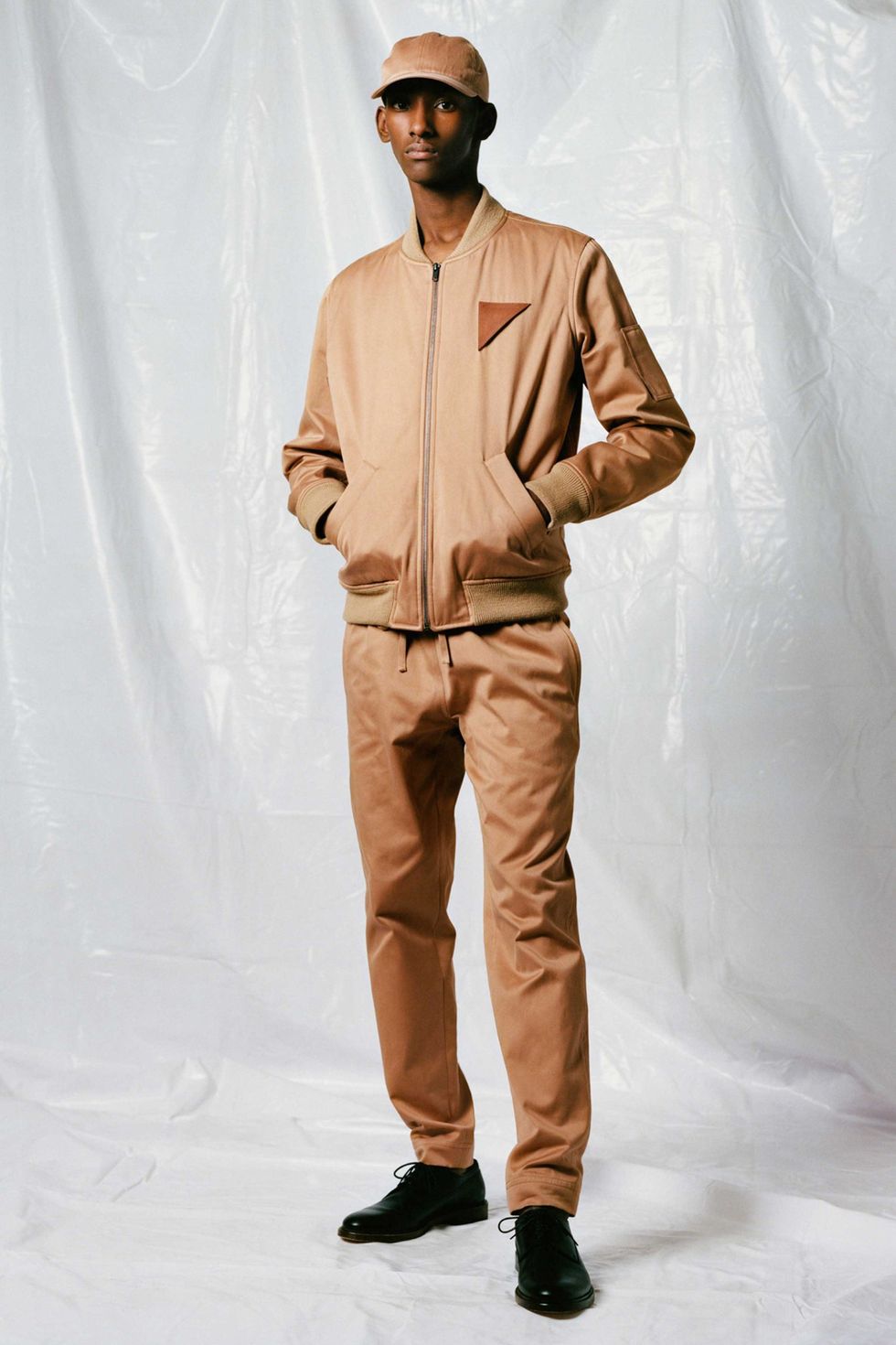 Brown, Sleeve, Dress shirt, Human body, Collar, Shoe, Khaki, Textile, Standing, Pocket, 