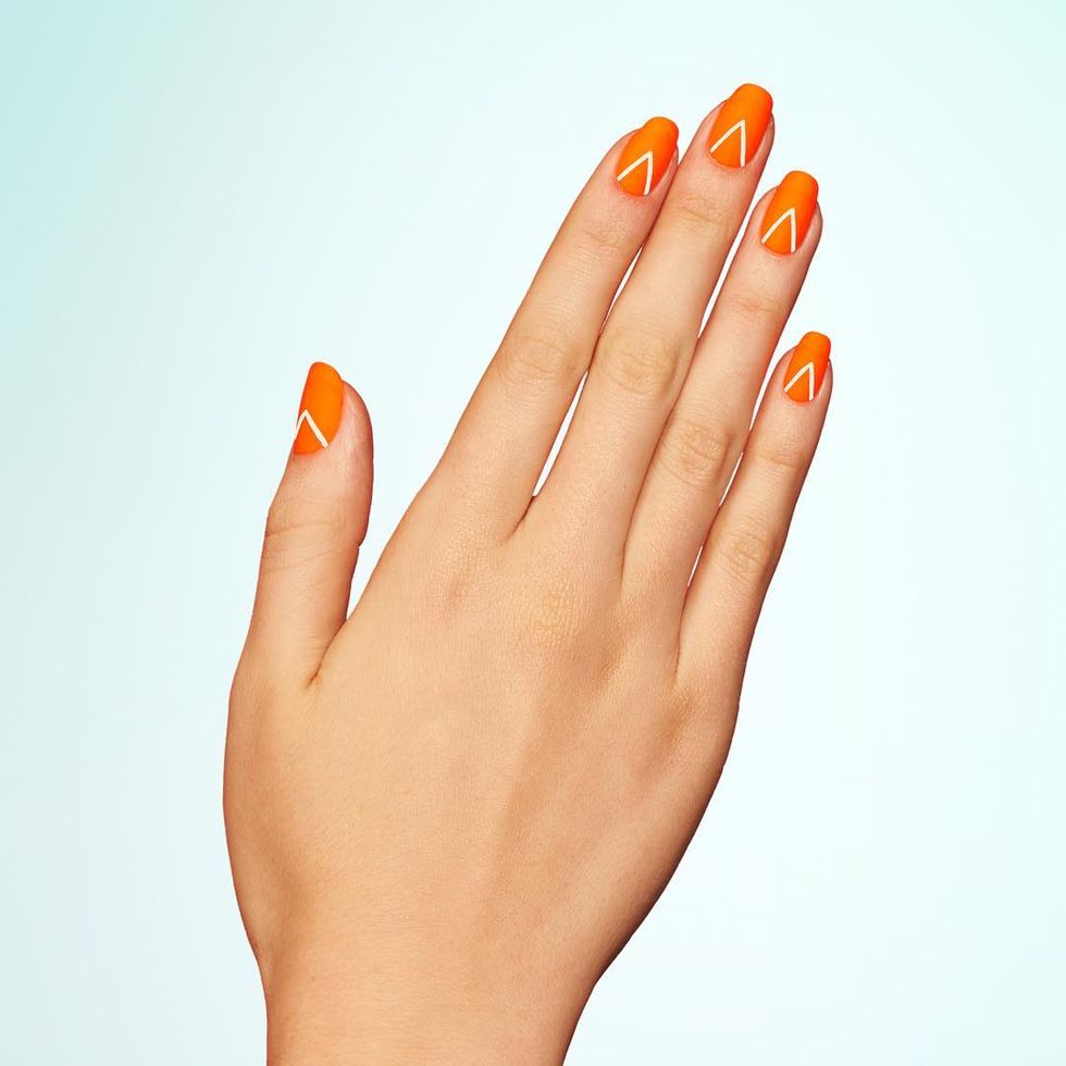 <p>Start with a neon orange base, then add an inverted-V to each nail. Once dry, set the look with a matte topcoat. </p><p>Design by <a href="https://www.instagram.com/p/BGqMw9DmsM4/" target="_blank">@paintboxnails</a></p>