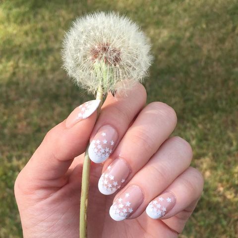 <p>For this star-spangled design give yourself a classic french tip manicure. Once dry apply a clear coat and while it's still tacky apply white star decals to the ends. Let dry and seal with a clear topcoat. <br></p><p><em>Design by </em><a href="https://www.instagram.com/p/BIlfSPTgrOe/q" target="_blank"><em>@primping_aint_easy</em></a></p>
