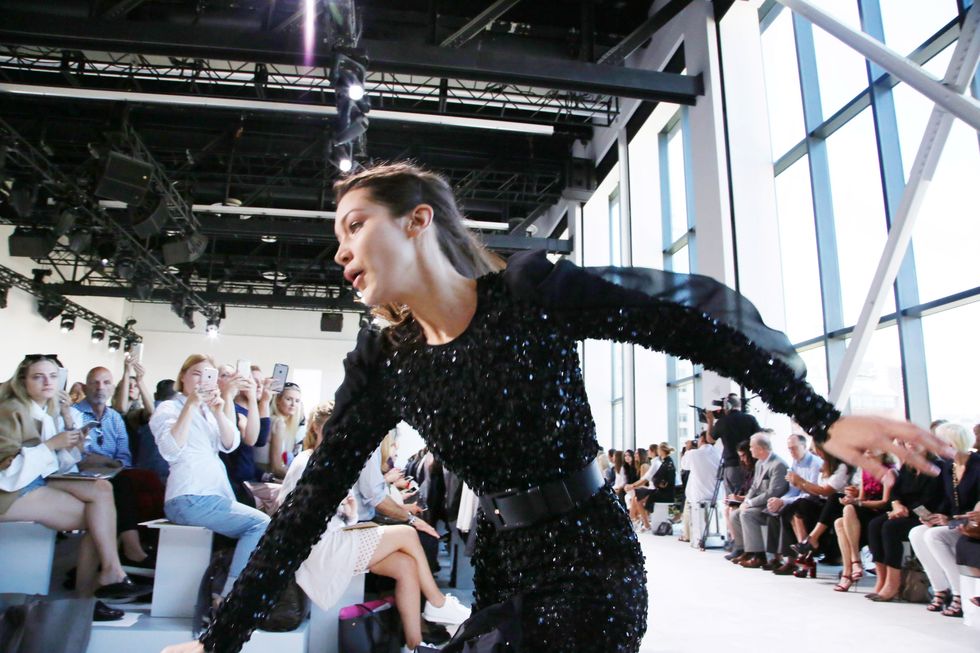 Bella Hadid Takes a Tumble at Michael Kors, Keeps on Smiling