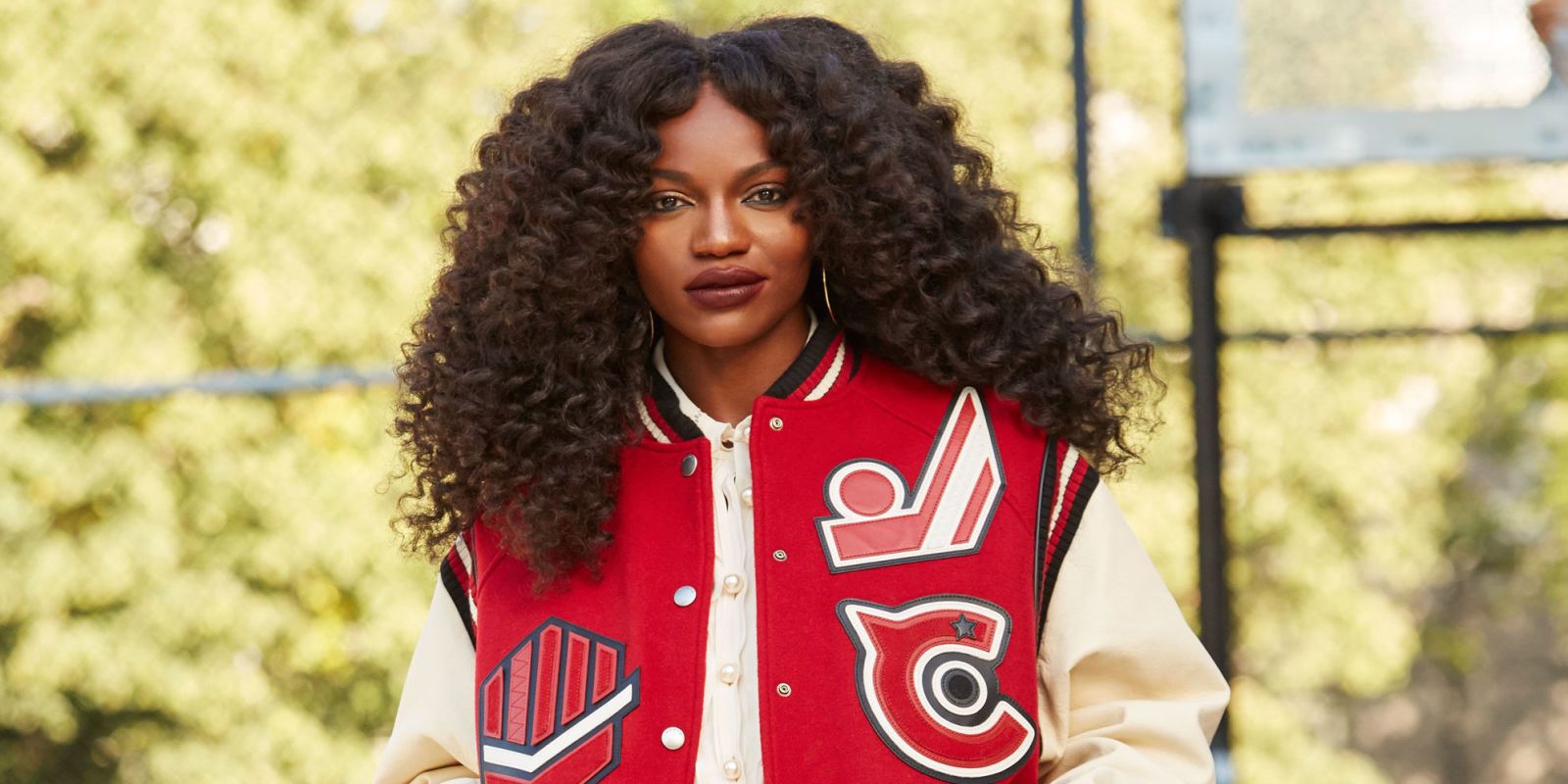 Girl wearing letterman jacket best sale