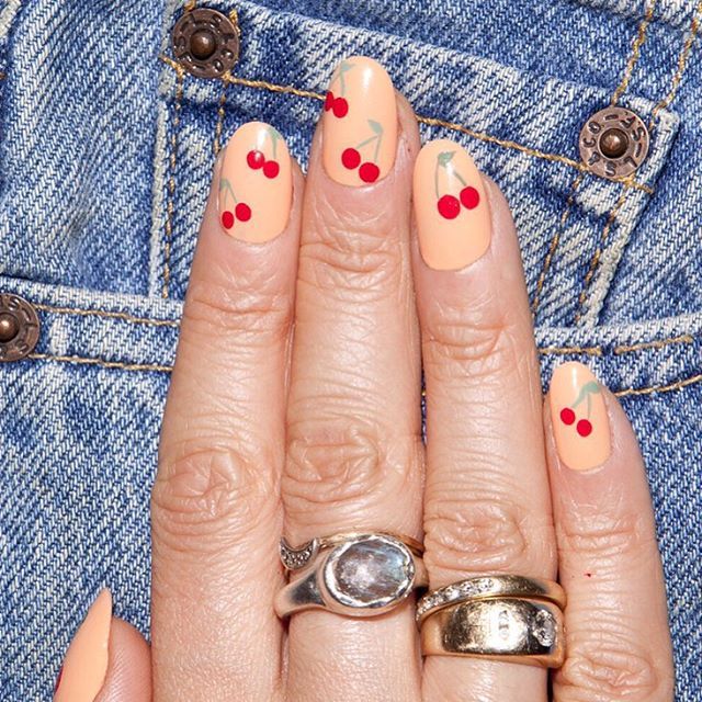 <p>Alternatively, use a pop of red on a neutral background. To get this cherry design, start with a nude base. Add pairs of red dots throughout, then use a thin brush to paint stems and leaves in green. Finish it off with a clear topcoat. </p><p><em data-redactor-tag="em" data-verified="redactor">Design by </em><a href="https://www.instagram.com/p/9o9HgNNShS/"><em data-redactor-tag="em" data-verified="redactor">@aliciatnails</em></a></p>