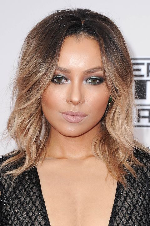 <p>Graham's hair is a prime example of the ombré look: Her brunette roots softly fade into a smokey blonde. </p>
