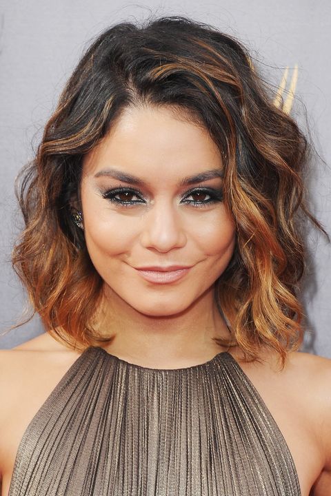<p>Hudgens' ombré hair is accented with face-framing toffee highlights.</p>