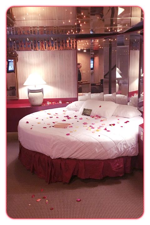 Lighting, Room, Interior design, Textile, Bedding, Red, Linens, Bed sheet, Floor, Pink, 
