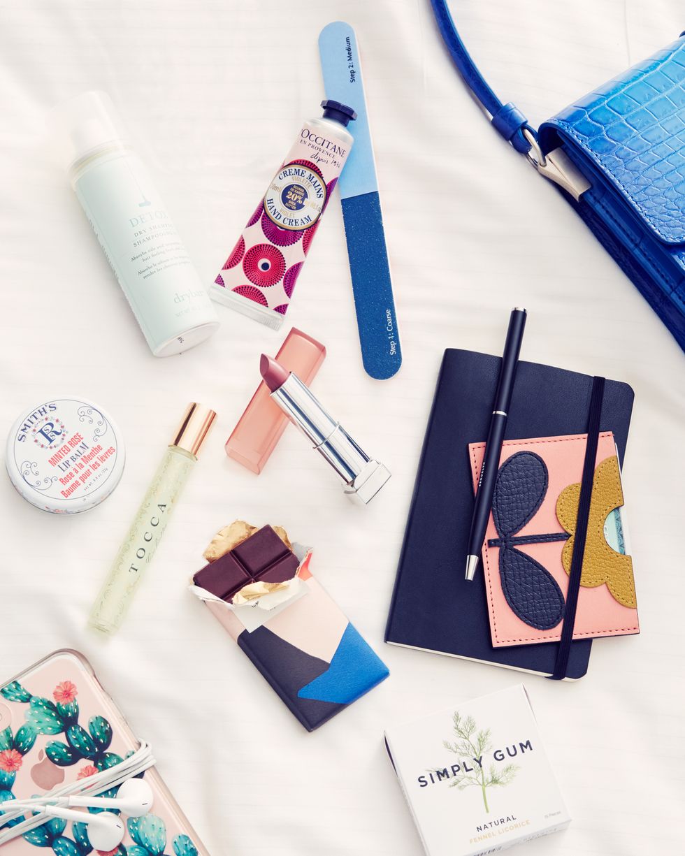 <p>"What's in my bag? Basically everything I'd need for a long flight. Lip balm, headphones, gum, a nail file, hand cream, dry shampoo (Dry Bar is the best!), and a bar of emergency dark chocolate.&nbsp;Since I'm usually on-the-go I'll opt for a Juice Press smoothie in the mornings—I'm a sucker for them."</p>