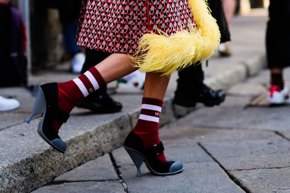 Footwear, Human leg, Carmine, Street fashion, Costume accessory, Fashion, Sock, Calf, Fur, Costume, 