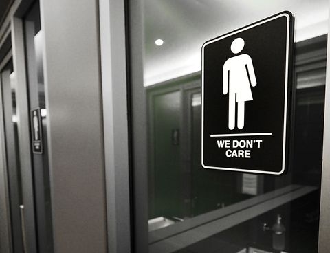Gender neutral signs are posted in the 21C Museum Hotel public restrooms on May 10, 2016 in Durham, North Carolina