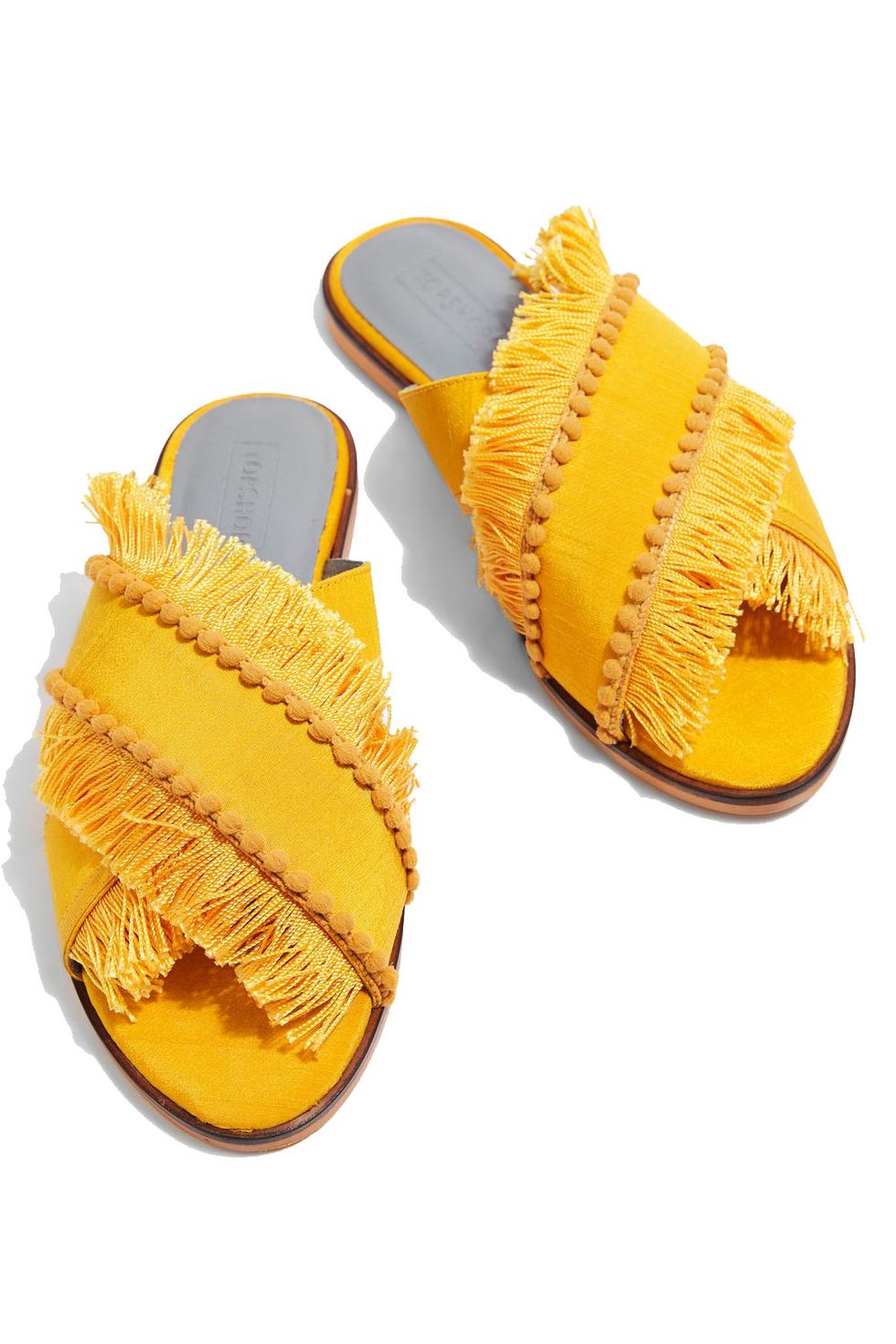 <p>Color goes the furthest wherever it's the biggest surprise. Swap neutral slides for bold yellow.</p><p><em data-redactor-tag="em" data-verified="redactor">Topshop Fran Fringe Sandals, $75; <a href="http://us.topshop.com/en/tsus/product/fran-crossover-fringe-sandals-6525678?bi=0&amp;ps=20&amp;Ntt=yellow" target="_blank" data-tracking-id="recirc-text-link">topshop.com</a></em></p>