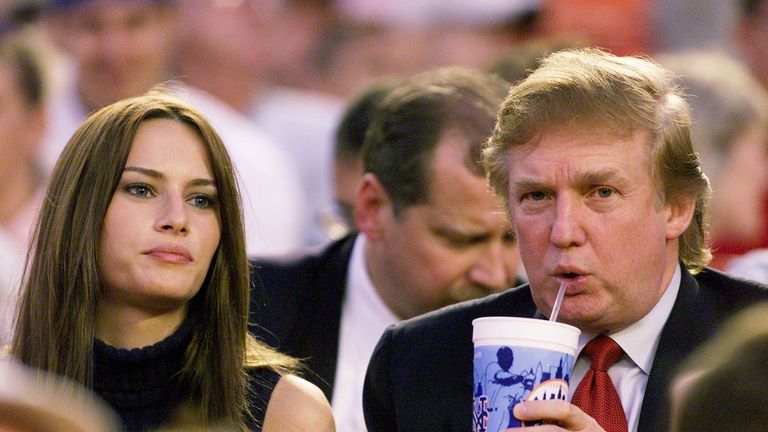 real estate magnate donald trump and girlfriend, model melania knauss, take in game between the new york mets and the colorado rockies at shea stadium