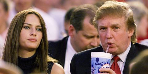 Real estate magnate Donald Trump and girlfriend, model Melania Knauss, take in game between the New York Mets and the Colorado Rockies at Shea Stadium