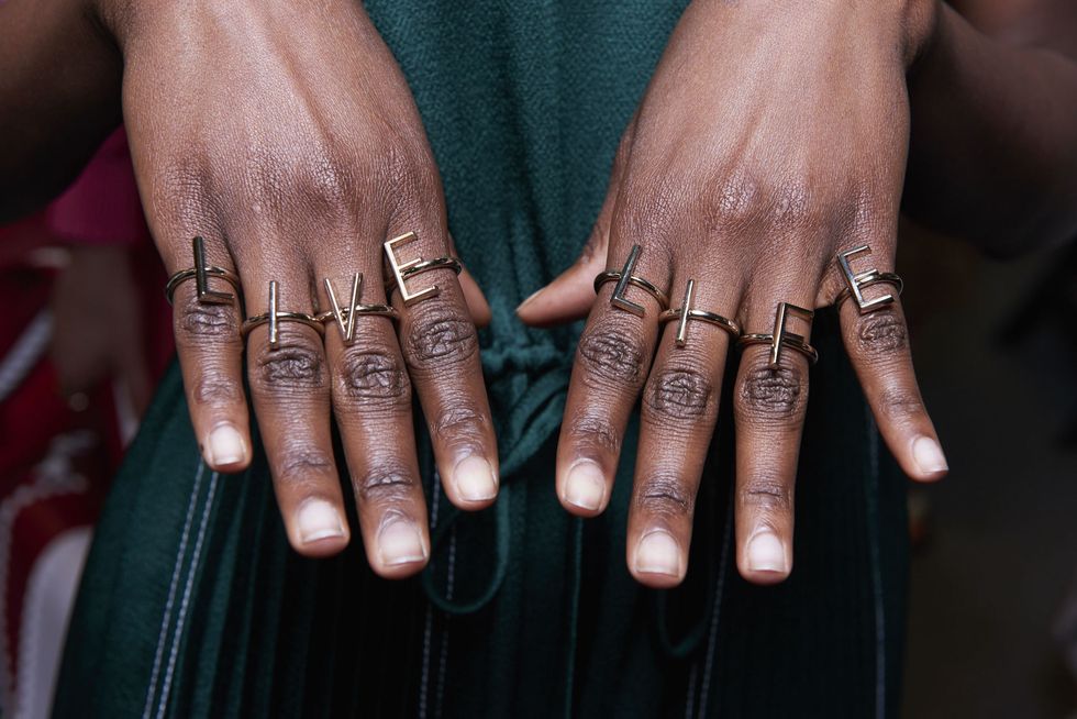 Nail, Finger, Hand, Skin, Ring, Close-up, Human, Wedding ring, Design, Material property, 