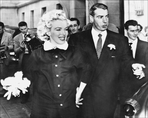 <p>Monroe and Yankee star Joe DiMaggio pictured after marrying at city hall in San Francisco on January 14, 1954.</p>
