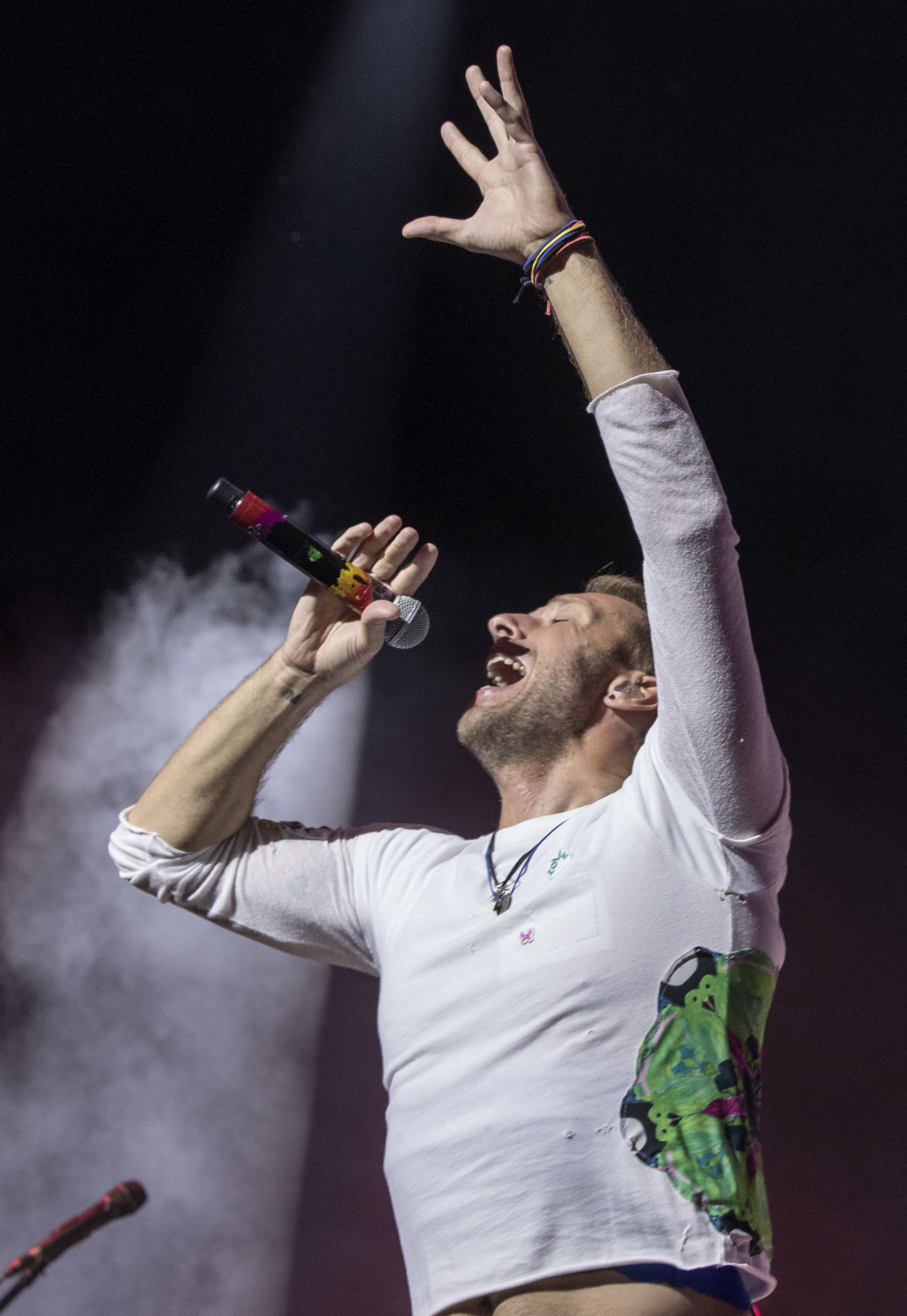 A History of Chris Martin s Most Beloved Tie Dye T Shirt