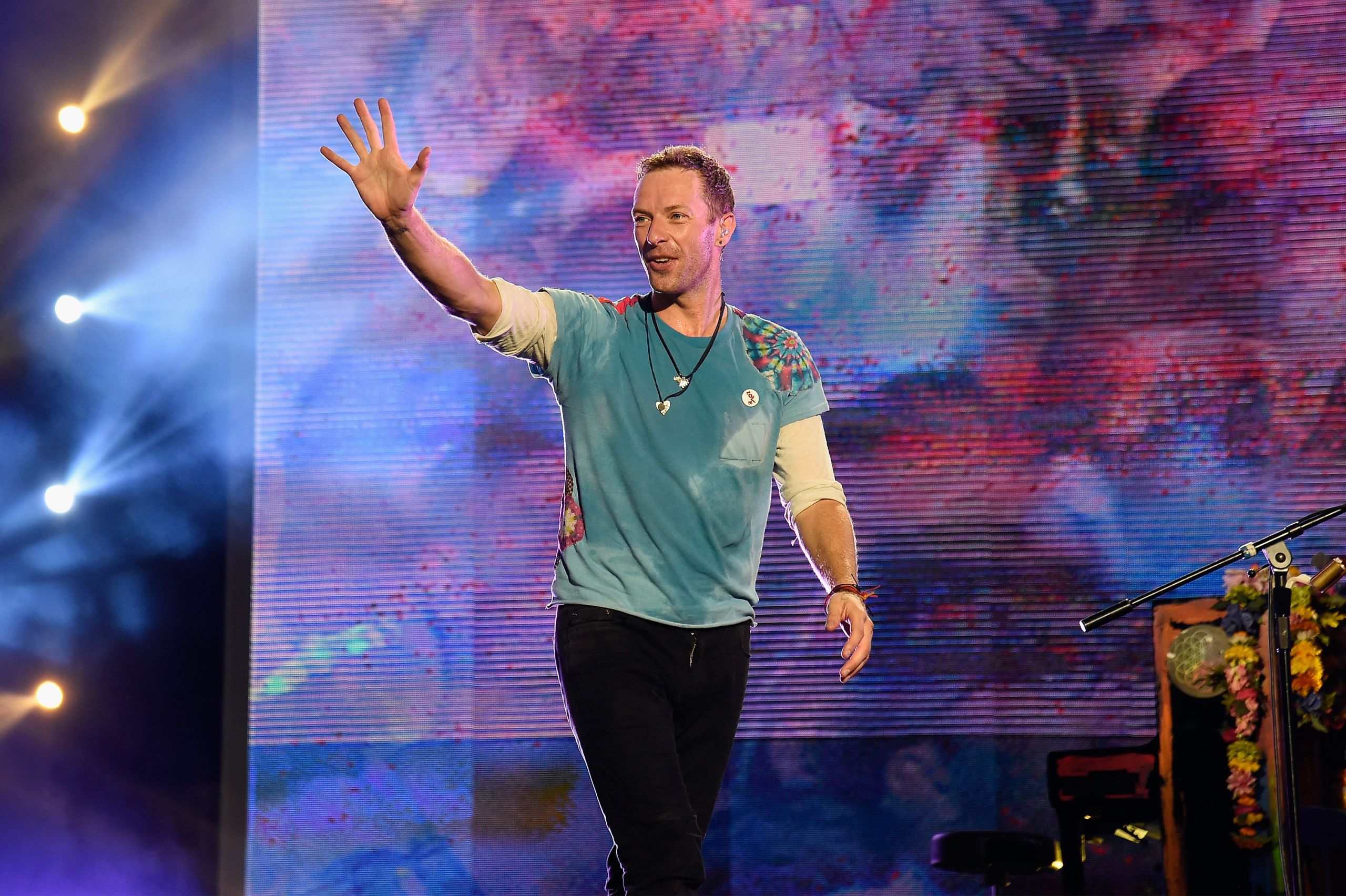 A History of Chris Martin s Most Beloved Tie Dye T Shirt