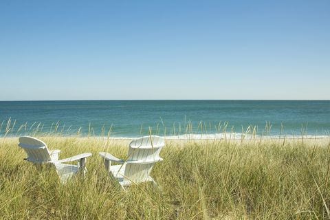 Adirondack Chairs in dunes at beach