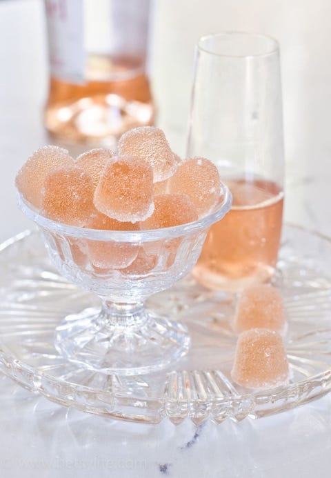 Rosé Wine Gumdrops <p>This classic candy just became even more fun to eat. Soak a batch of gelatin candies with rosé to make these fun sweets. Once they've cooled, roll the gummies in sugar and bon appétit!</p><p><em data-redactor-tag="em"><a href="http://betsylife.com/recipe/rose-wine-gumdrops/" target="_blank">Via Betsy Life</a></em></p>