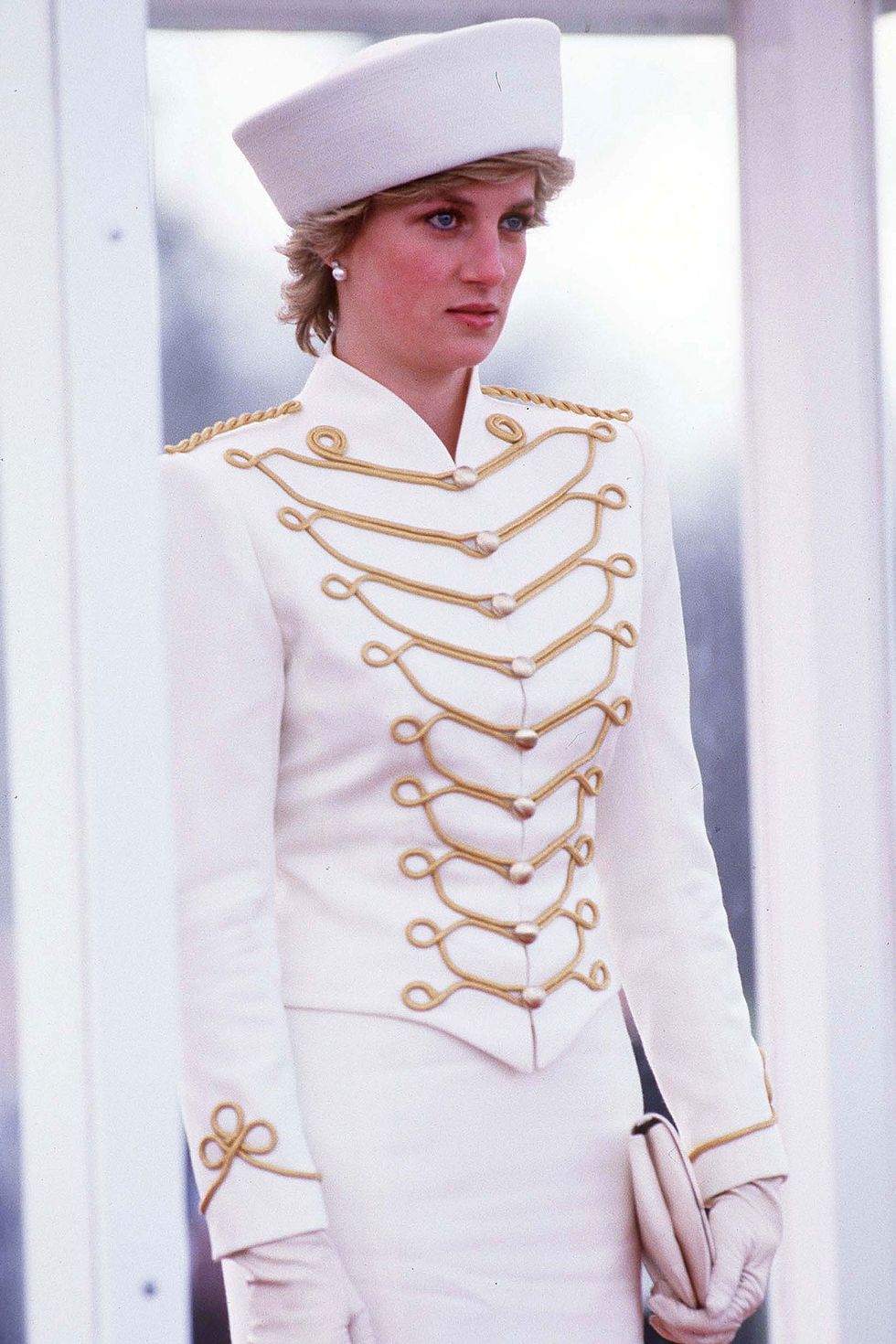 <p>Diana channels military-chic in this white and gold set.&nbsp;</p><p><strong data-redactor-tag="strong" data-verified="redactor">RELATED: </strong><a href="http://www.redbookmag.com/life/g2805/princess-diana-rare-photos/" target="_blank" data-tracking-id="recirc-text-link"><strong data-redactor-tag="strong" data-verified="redactor">17 Gorgeous Photos of Princess Diana You've Never Seen Before</strong></a></p>