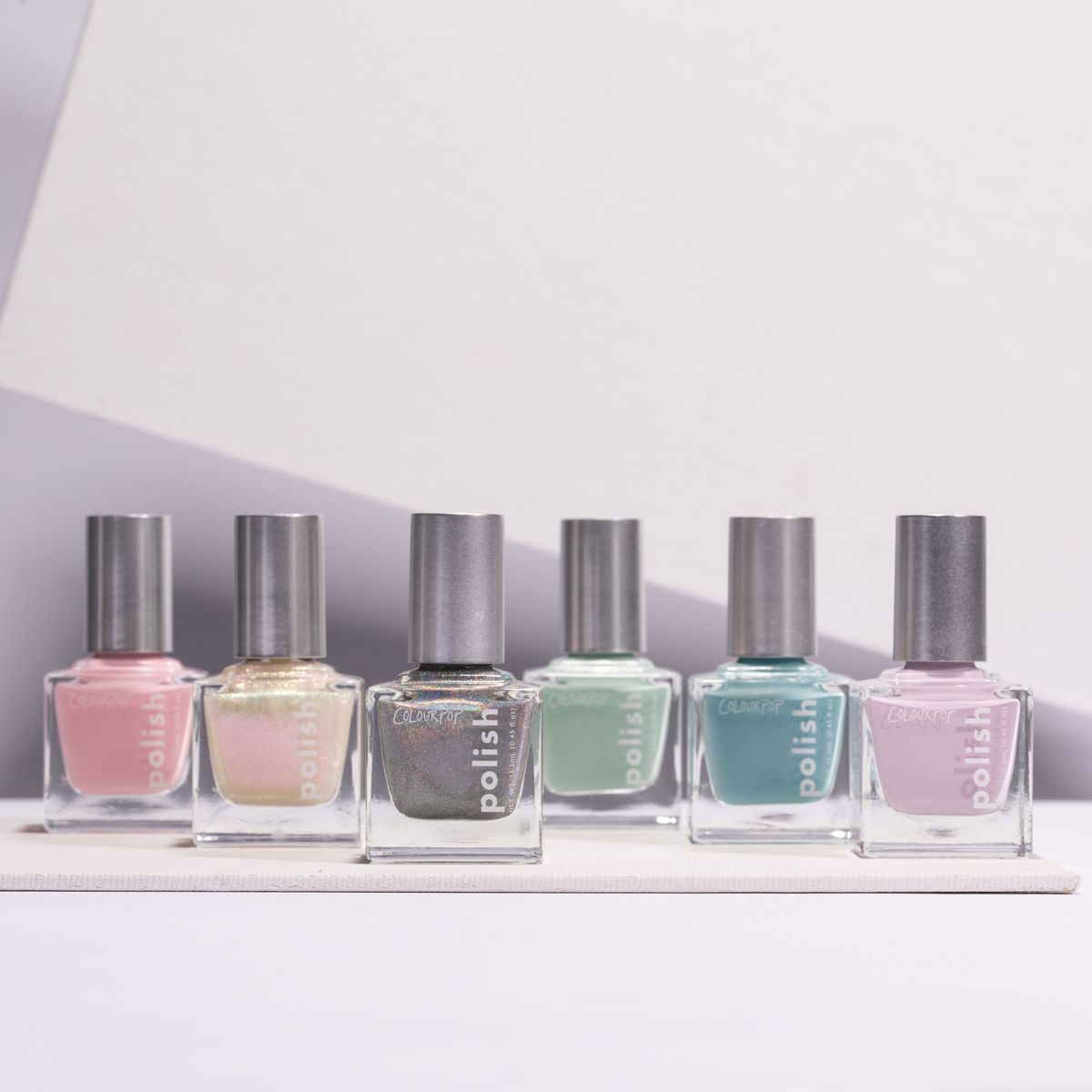 Nail polish, Blue, Cosmetics, Nail care, Product, Glass bottle, Pink, Beauty, Lilac, Bottle, 