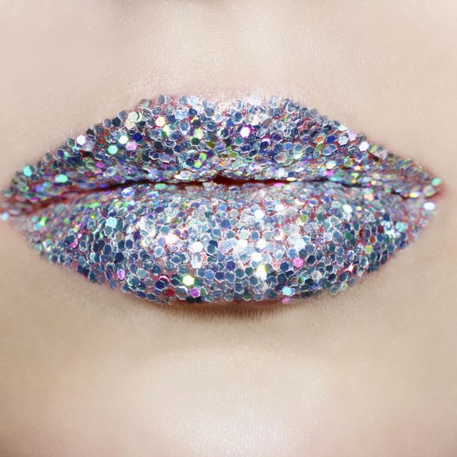 Close up of lips covered in silver glitter