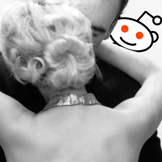 A man and woman hugging with the Reddit logo behind them