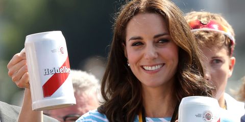 On day 4 of her Royal tour of Poland and Germany, The Duchess of Cambridge pulled a move I'm very familiar with. Donning a medal for deception – but actually for participating in a rowing match against Prince William – Kate Middleton pretended to be excited about the prospect of drinking a, frankly, preposterous amount of beer.