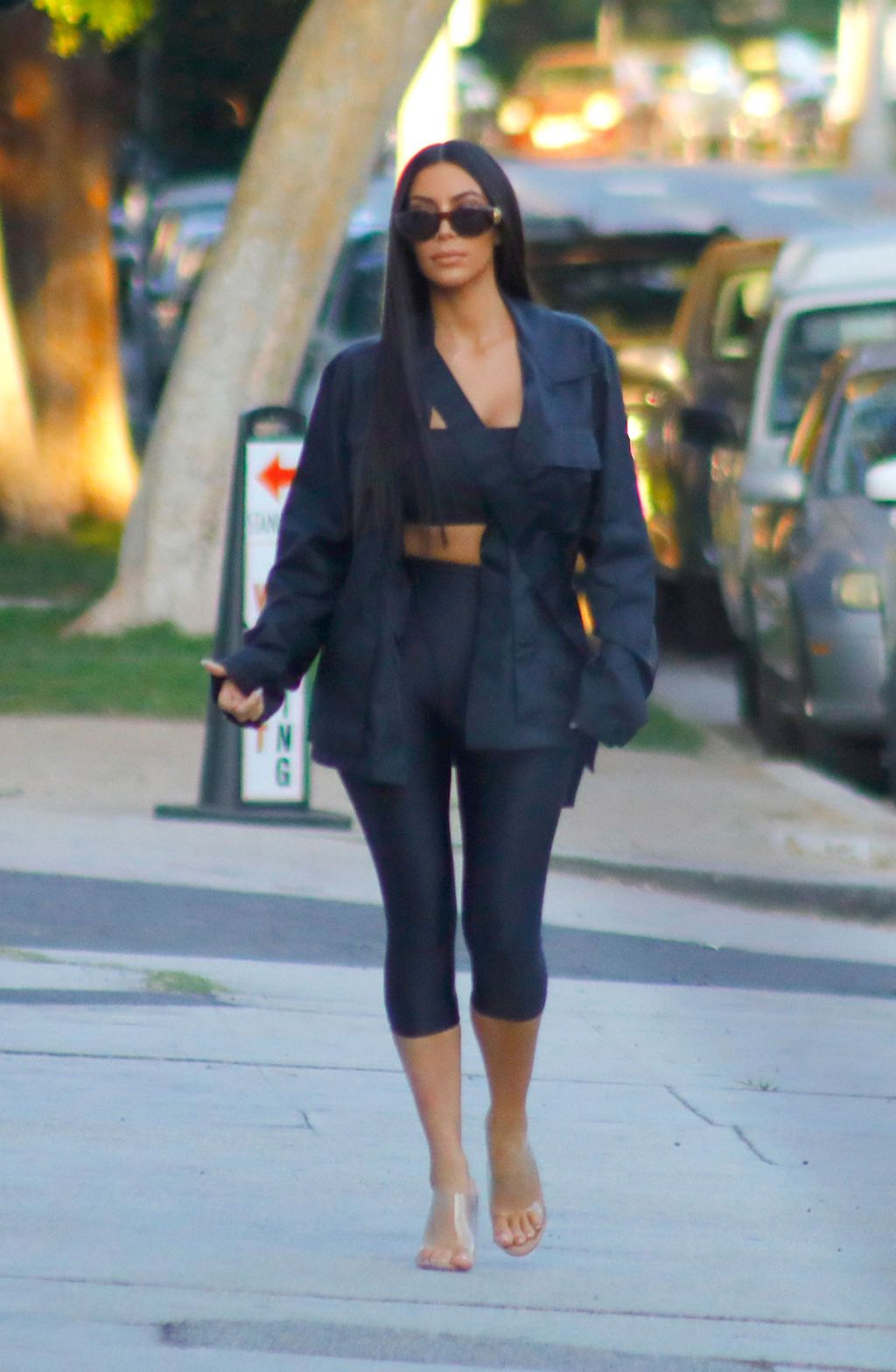 Kim Kardashian In Hoodie And Biker Shorts - Kim Kardashian Fashion Photos