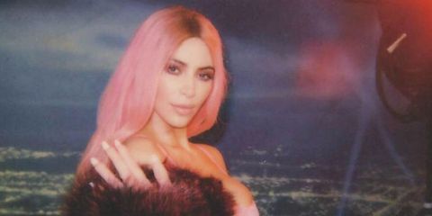 Kim Kardashian West as Lil' Kim