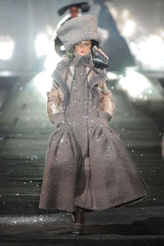 Standing, Winter, Overcoat, Fur, Fur clothing, Boot, Glove, Frock coat, Costume, Trench coat, 