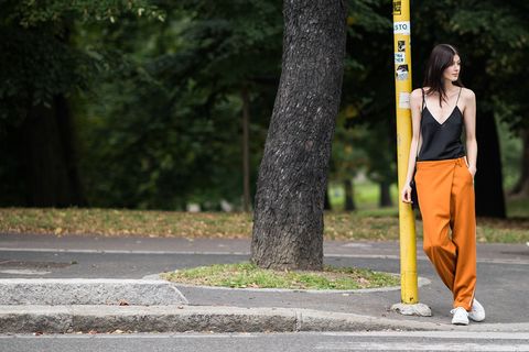 Road, Green, Road surface, Asphalt, People in nature, Street fashion, Waist, sweatpant, Active pants, Curb, 