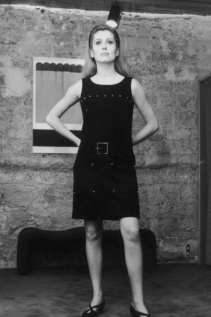 Portrait of Chanel wearing a little black dress, a typical hat, her