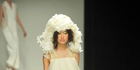 Clothing, Footwear, Hairstyle, Shoulder, Fashion show, White, Dress, Runway, Style, Fashion model, 