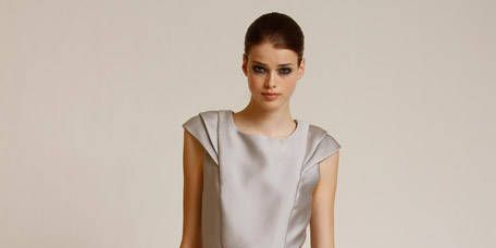 Sleeve, Shoulder, Dress, Human leg, Joint, Standing, White, One-piece garment, Style, Formal wear, 