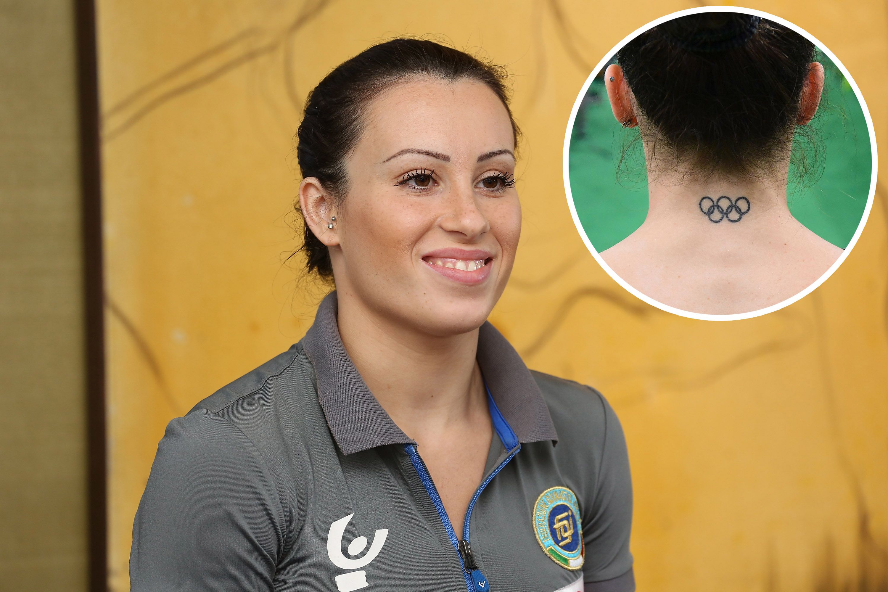 Italy's Vanessa Ferrari has a tattoo of the Olympic rings on the back her  next at the gymnastics..., Stock Photo, Picture And Rights Managed Image.  Pic. PAH-44454392 | agefotostock