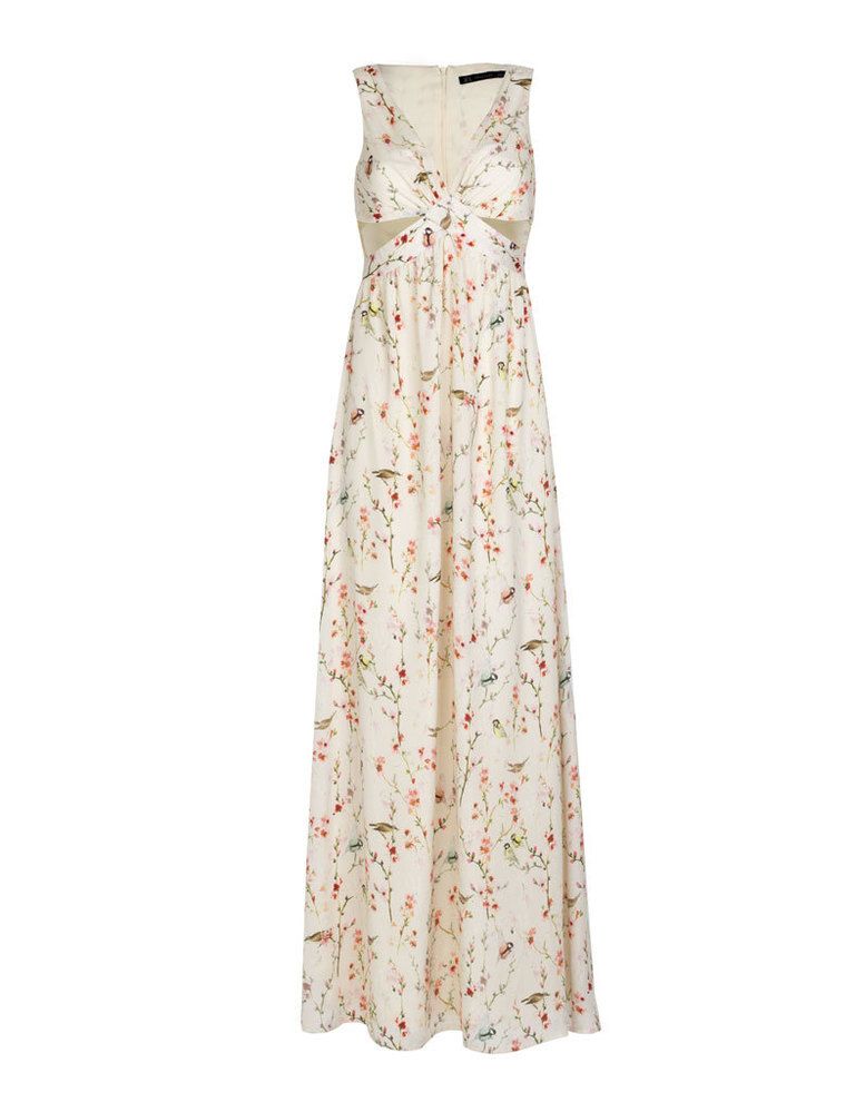 <p>Vestidod e flores con aberturas, <strong>de Zara por 49,95 €.</strong></p>
