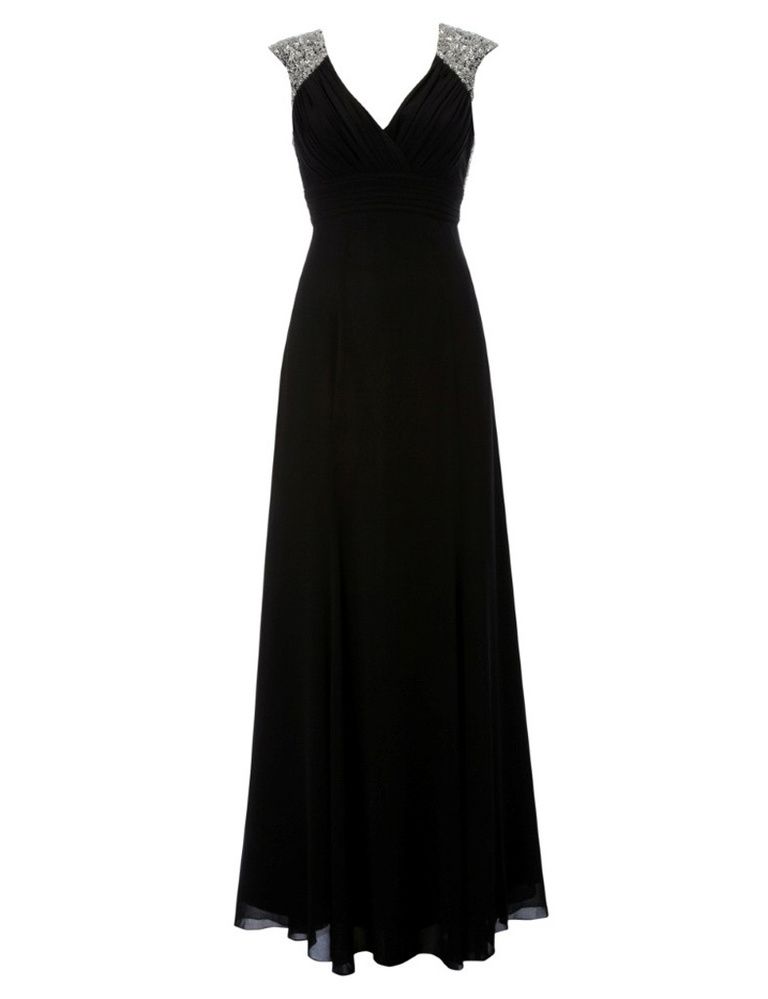 <p>Un estili similar encontramos en este vestido negro con hombros de brillos de<strong> Lipsy por 230 €.</strong></p>