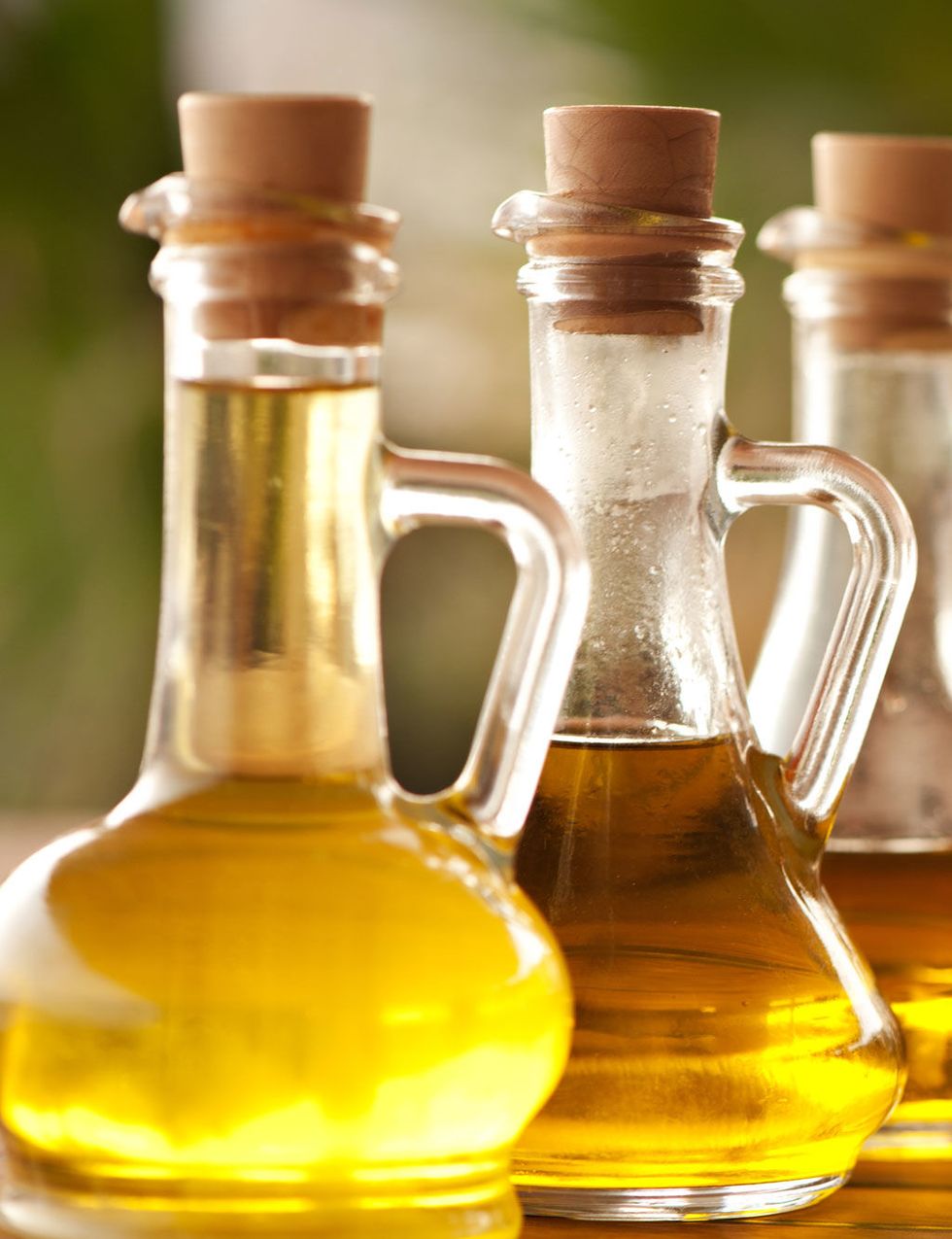 Vegetable oil, Glass bottle, Yellow, Bottle, Soybean oil, Cooking oil, Glass, Cottonseed oil, Drink, Honey, 