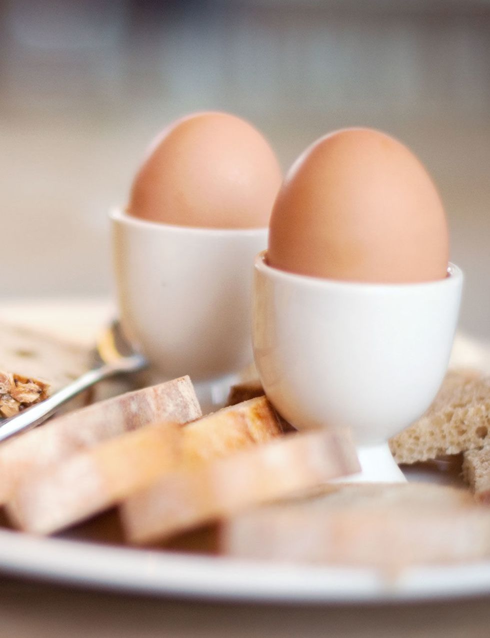 Egg, Egg, Egg cup, Food, Boiled egg, Serveware, Dish, Tableware, Ingredient, Finger food, 