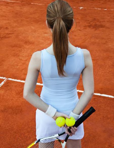 Hairstyle, Shoulder, Elbow, Sports equipment, Joint, Style, Orange, Tennis racket, Back, Tennis ball, 