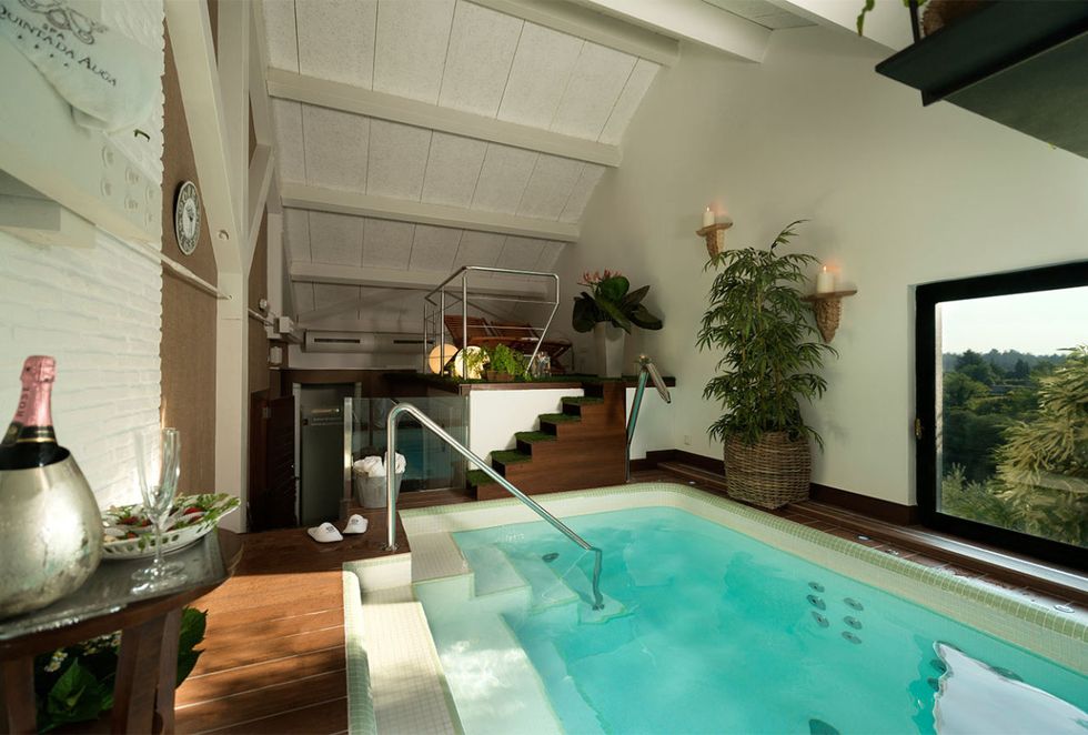 Swimming pool, Fluid, Green, Property, Interior design, Ceiling, Real estate, Tile, Interior design, Aqua, 