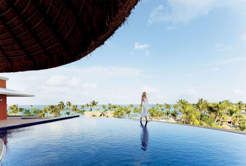 Resort, Swimming pool, Azure, Tropics, Shade, Sun hat, Fedora, Eco hotel, Caribbean, Resort town, 
