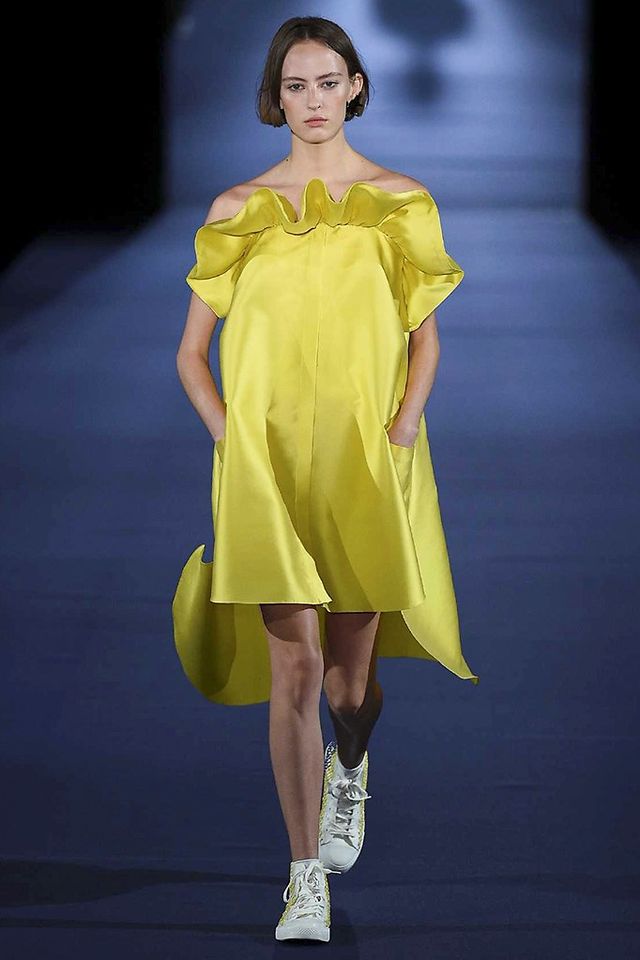 Yellow, Shoulder, Dress, Joint, Human leg, One-piece garment, Fashion model, Style, Formal wear, Fashion, 
