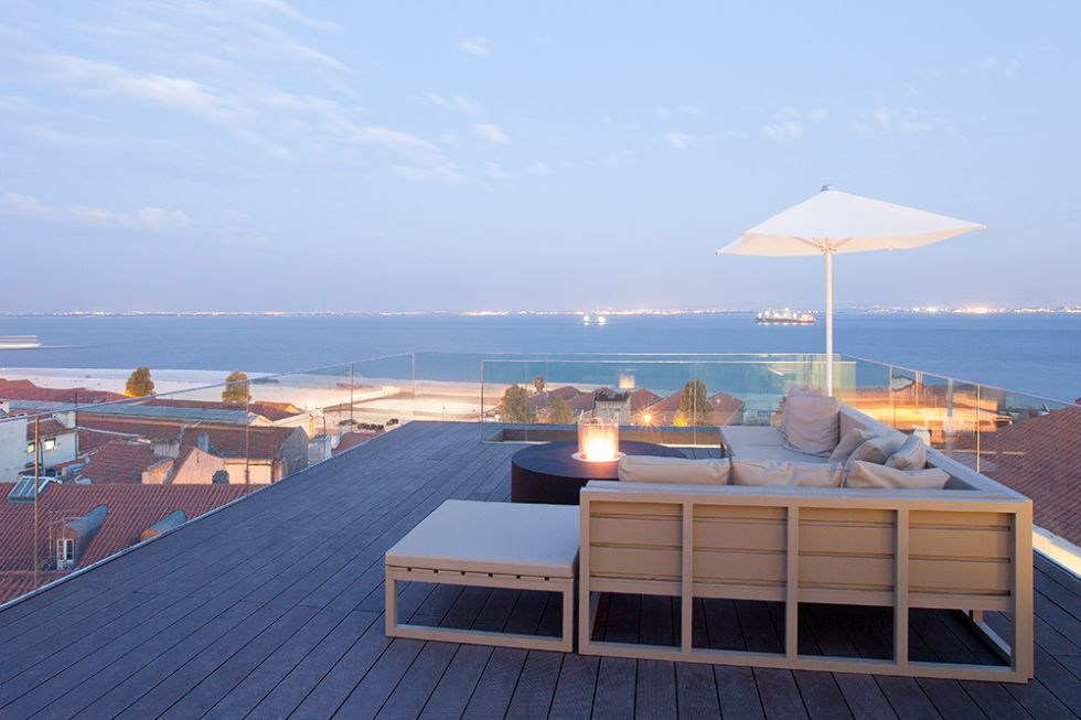Outdoor furniture, Real estate, Roof, Horizon, Ocean, Resort, Sea, Shade, Outdoor table, Sunlounger, 