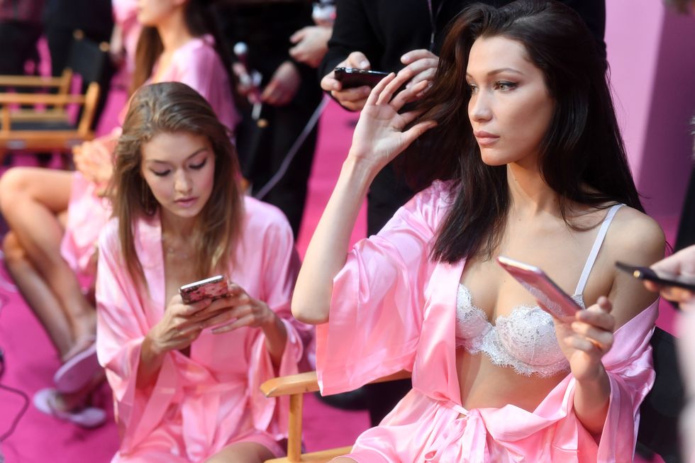 PARIS, FRANCE - NOVEMBER 30:  Gigi Hadid and Bella Hadid have their Hair &amp; Makeup done prior the 2016 Victoria's Secret Fashion Show on November 30, 2016 in Paris, France.  (Photo by Pascal Le Segretain/Getty Images for Victoria's Secret)