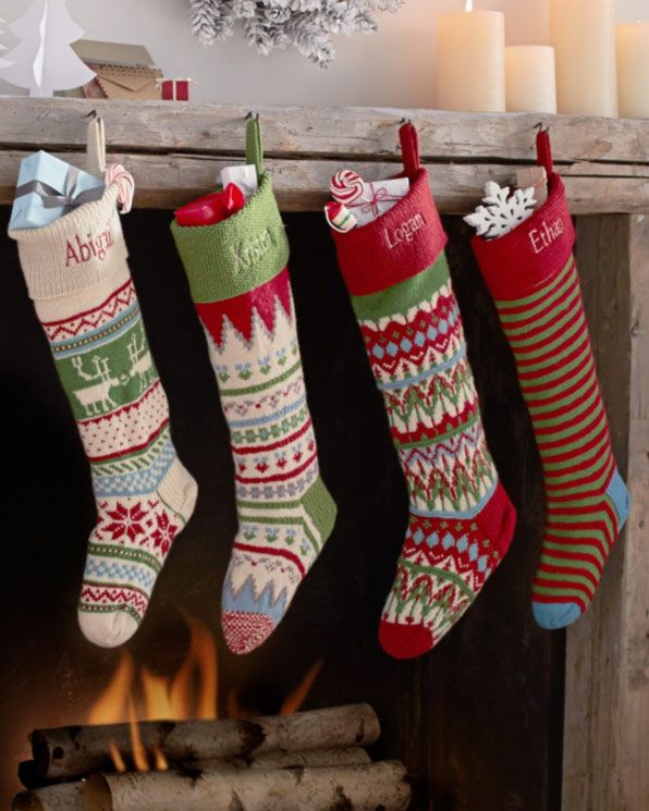 Christmas stocking, Sock, Carmine, Interior design, Christmas decoration, Christmas, Candle holder, Holiday, Foot, Candle, 