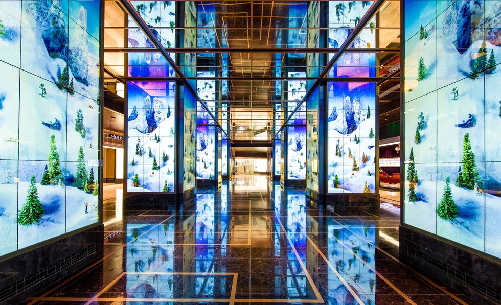 Glass, Majorelle blue, Interior design, Fixture, Ceiling, Colorfulness, Symmetry, Lobby, Transparent material, Tile, 