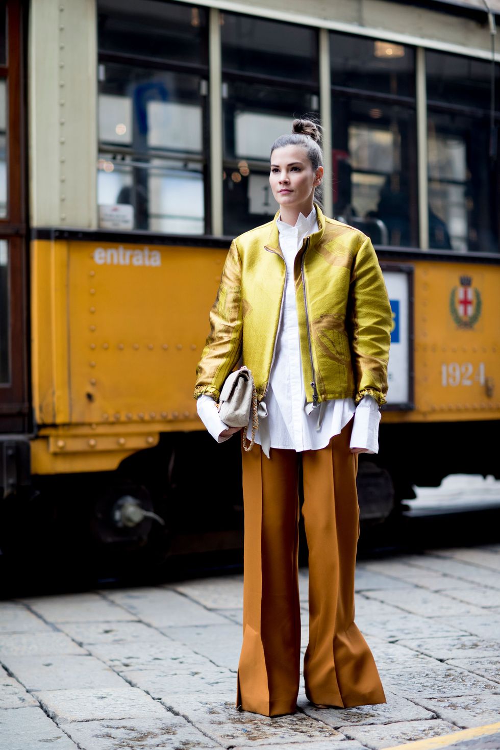 Yellow, Coat, Style, Jacket, Street fashion, Collar, Public transport, Bag, Blazer, Snapshot, 